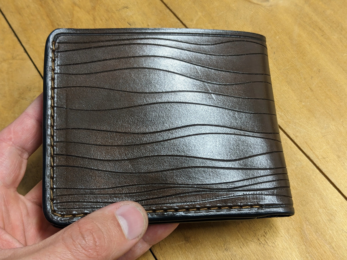 Handmade leather LOZ wallet by Theodoros Leather, showcasing sleek artisanal craftsmanship for free international shipping.