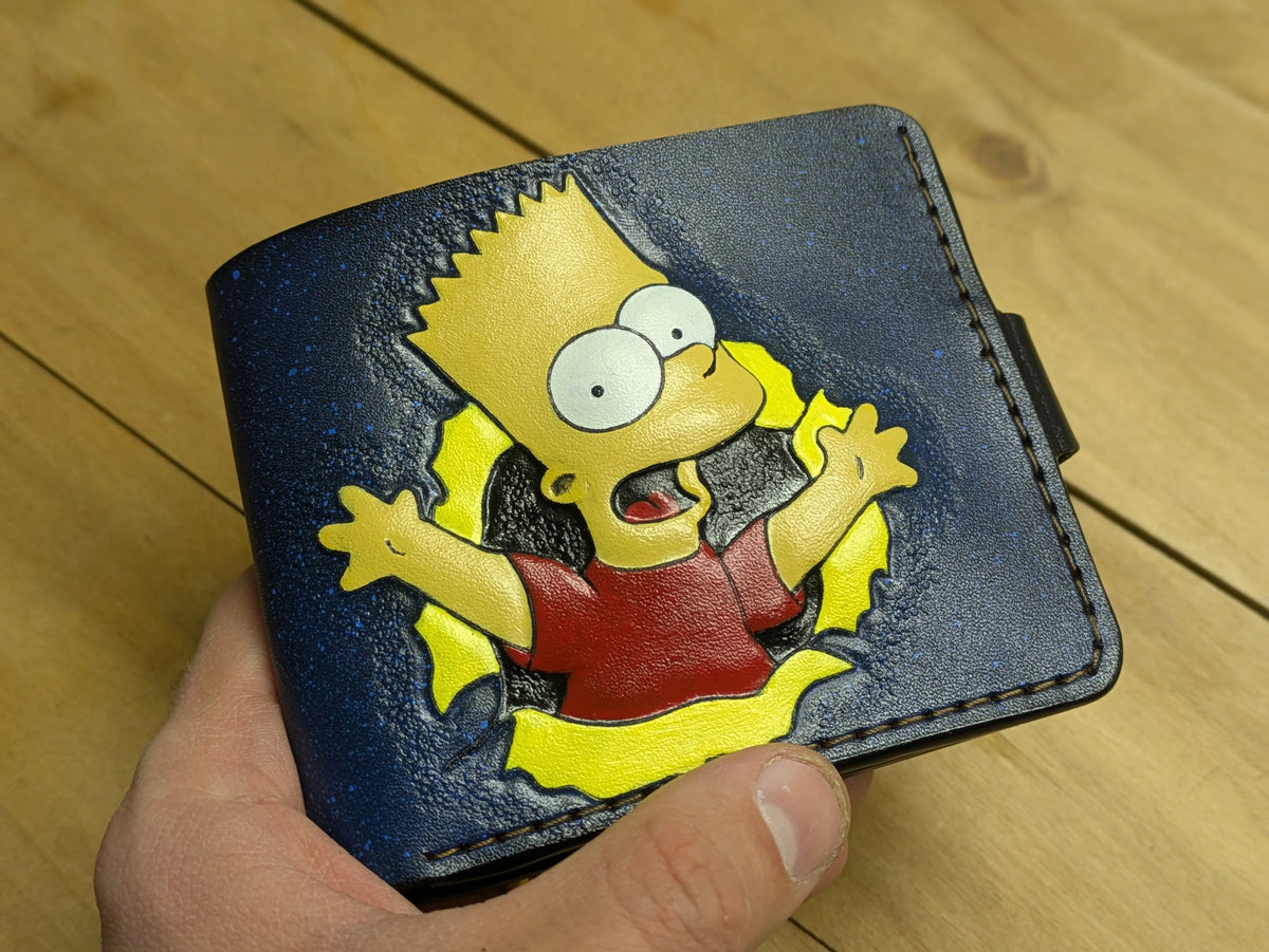 Artisan close-up of a hand-tooled Bart Simpson bifold wallet showing the high-detail carving and textured leather finish.