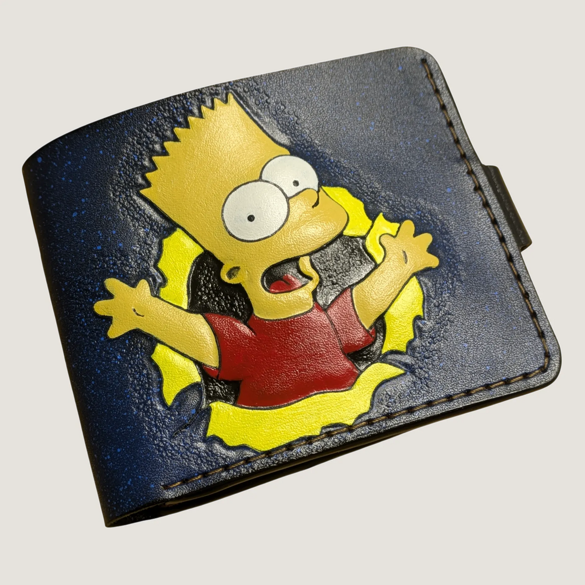Hand-tooled Bart Simpson leather wallet featuring a vibrant hand-painted design on premium blue full-grain leather.