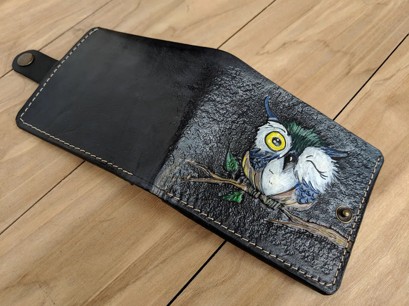 Leather bifold wallet featuring cartoon Christmas owl design