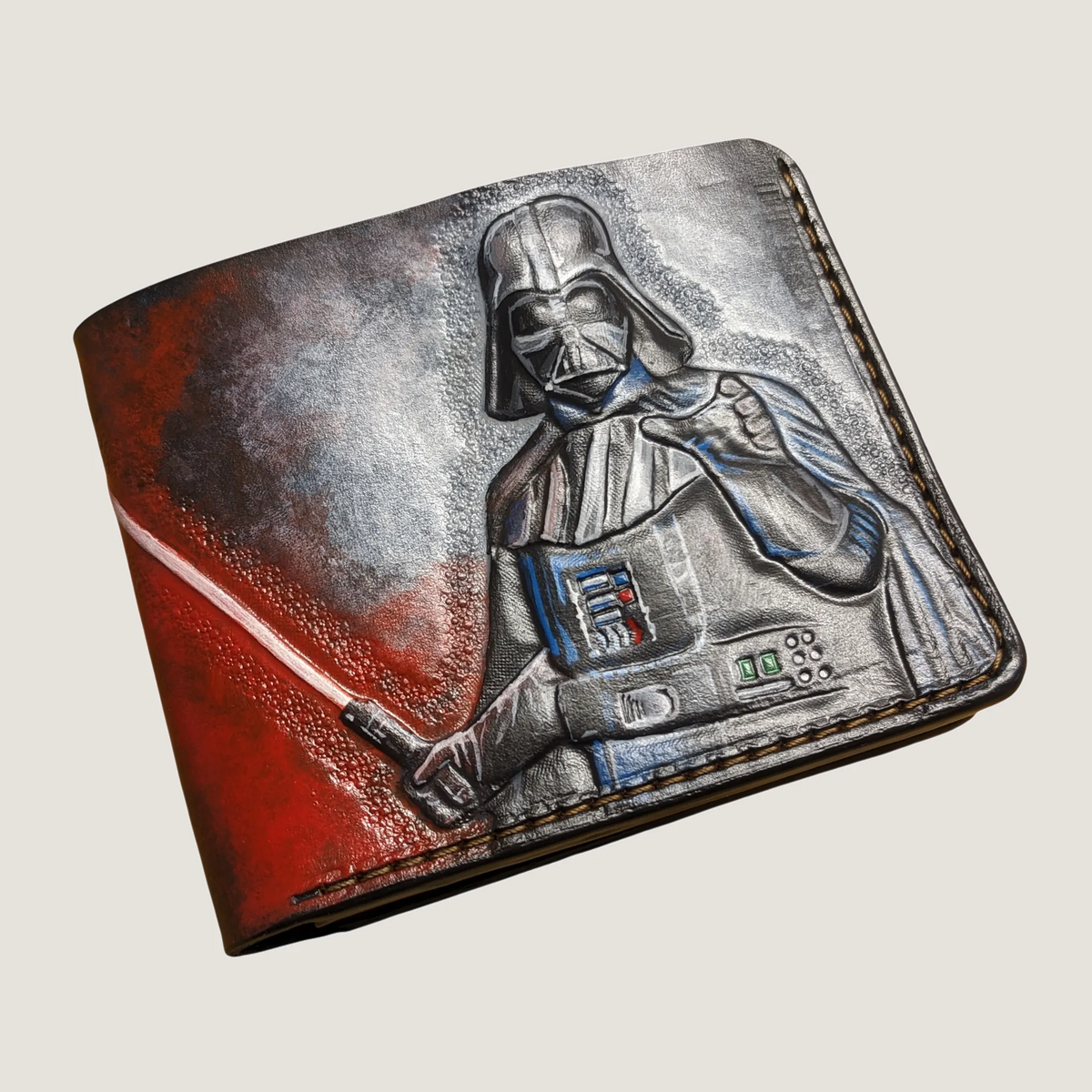 Hand-tooled Star Wars leather bifold wallet featuring a detailed Darth Vader helmet carving on a clean studio background.