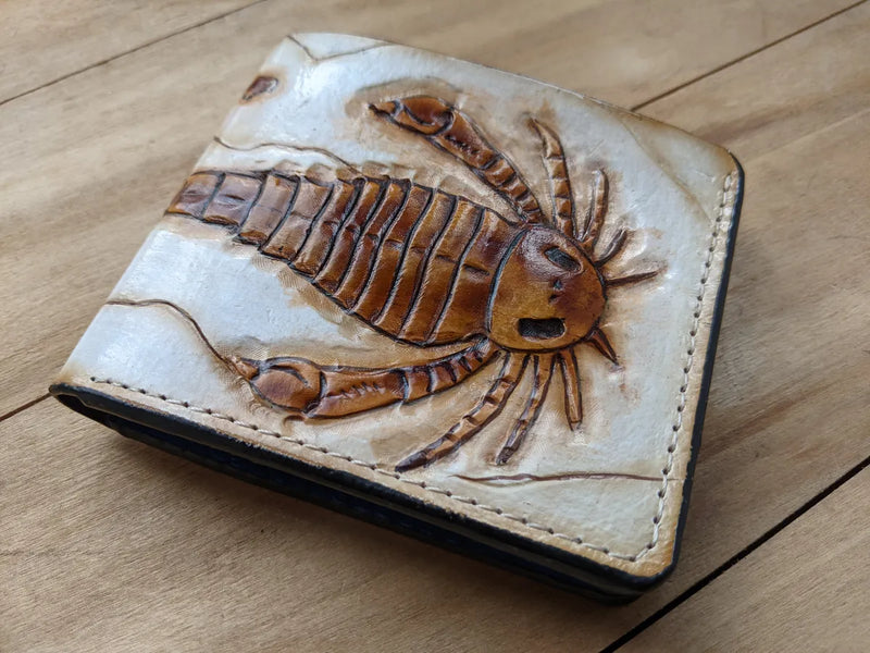 Handmade leather bifold wallet with eurypterid sea scorpion fossil design