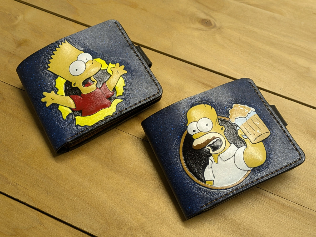 Pair of hand-tooled Bart and Homer Simpson leather wallets, custom hand-painted pop culture leathercraft designs.