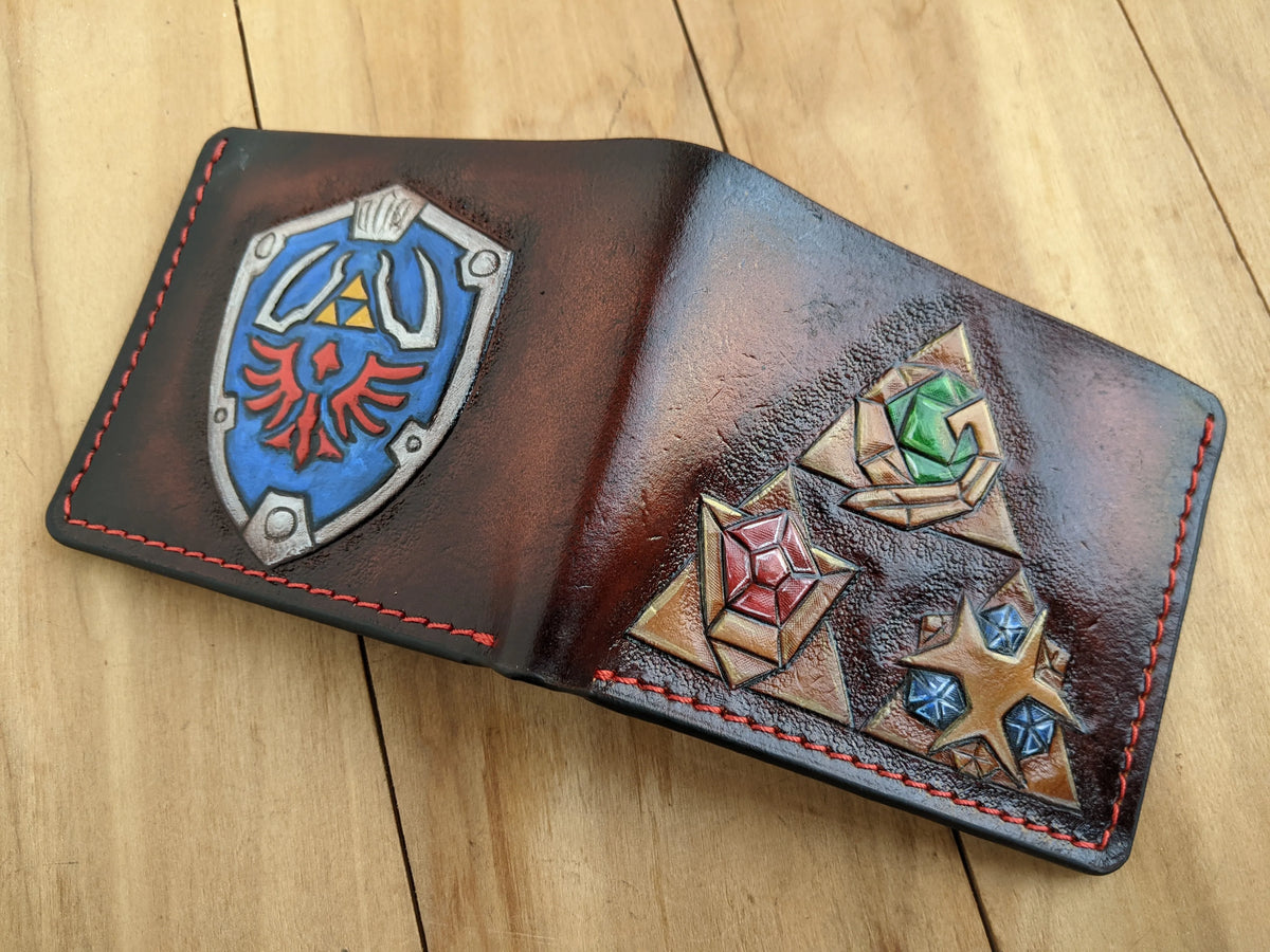 Hand-tooled full-grain leather men's LOZ wallet with custom Zelda Hylian Shield, created by Theodoros artisan leatherworkers.