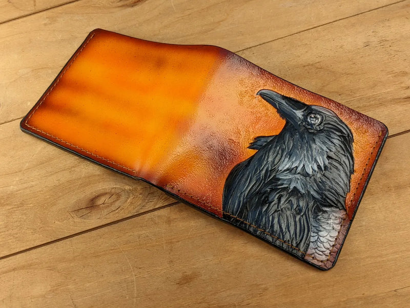 Handcrafted leather bifold wallet with Odin raven embossing