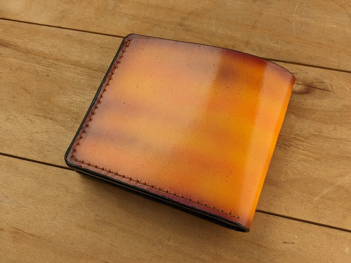 Leather bifold wallet inspired by Odin’s ravens in Norse mythology