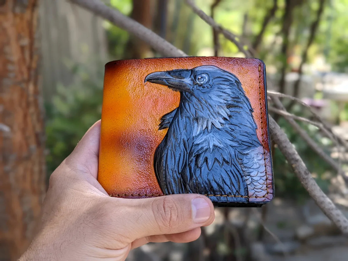 Embossed bifold leather wallet featuring Odin raven design