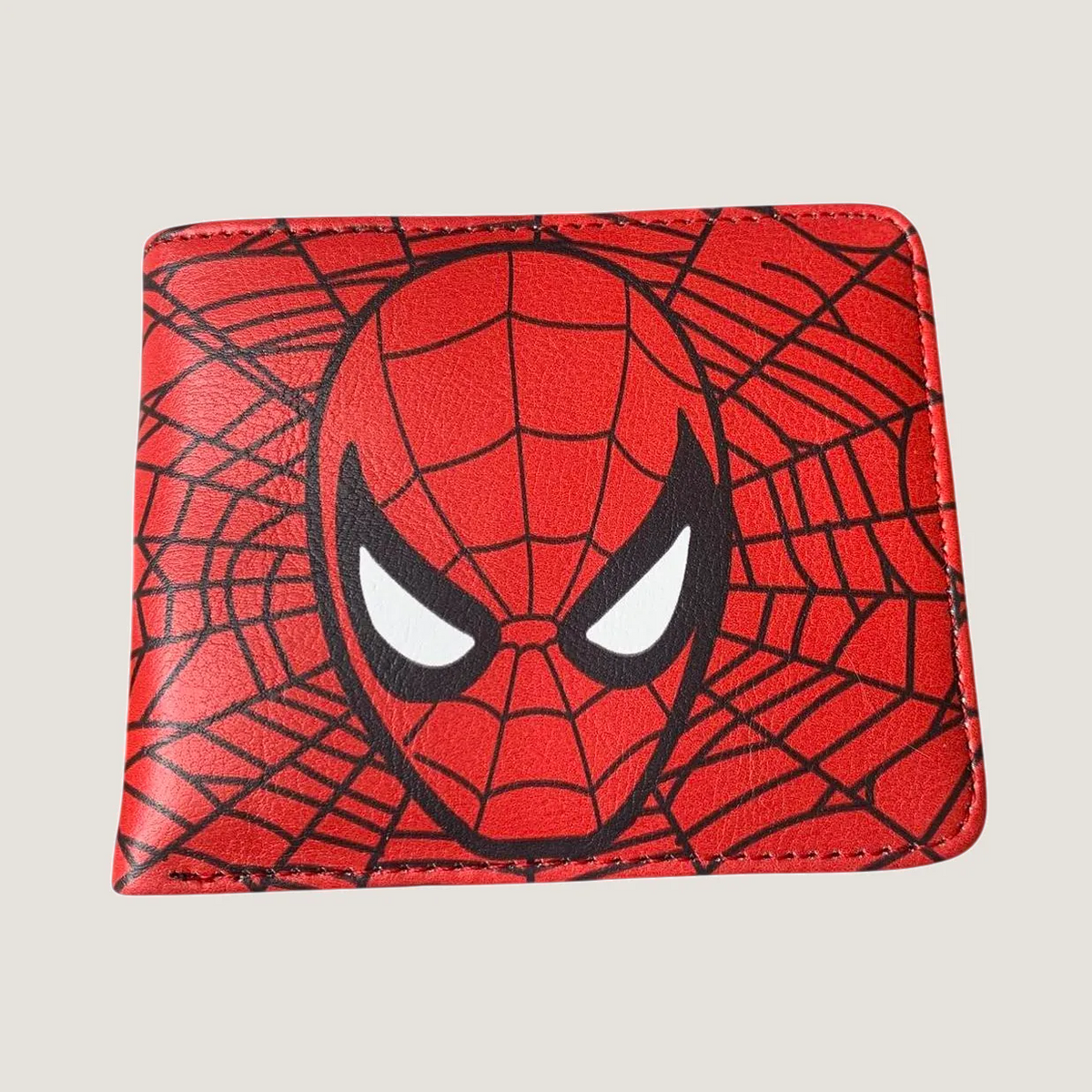Red Spider Man bifold wallet featuring a large graphic print of the superhero mask and web design on a plain background.