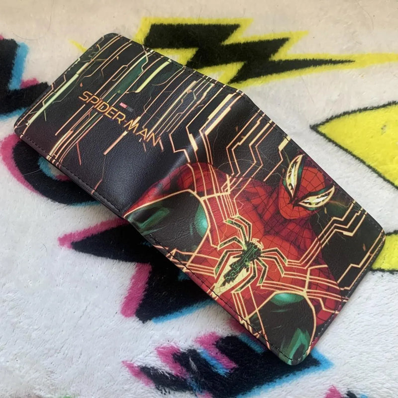 Fully opened black bifold leather wallet showing the Marvel Studios Spider-Man logo on the back and suit graphic on the front.