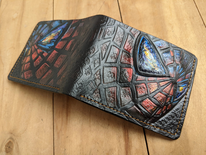 Spider-Man full-grain leather wallet by Theodoros Leather featuring an open bifold design with continuous hand-tooled craftsmanship